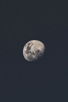 the full moon is seen in the dark sky