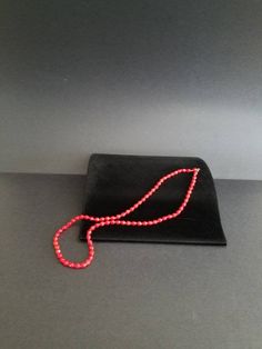 This is a vintage single strand necklace features multifaceted red beads, each separated by a tiny red seed bead, both reminiscent of cherry red or fire engine red. Each bead is roughly .25 inches thick Will be packaged in a gift box. Some pictures are enlarged to show detail. Does not include any props in photos. Please feel free to contact me with any questions you may have. Before you buy, please note that the items in my shop are pre-owned and may (or may not) have some signs of wear (scratc Gift Faceted Beads Beaded Necklace, Round Faceted Beads Necklace As Gift, Gift Faceted Beads Necklace, Formal Red Beaded Jewelry, Red Polished Beads Jewelry For Formal Occasions, Formal Red Jewelry With Polished Beads, Red Beaded Necklaces As A Gift, Red Beaded Necklaces With Faceted Beads, Red Oval Beads Jewelry For Gift