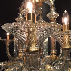 a gold chandelier with three lights on it