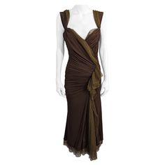 Donna Karan Collection's Sexy Draped Jersey Dress in deep chocolate stretch rayon jersey with greenish gold knit tulle cascade. Donna Karan gowns are seemingly simple in cut but are actually quite complicated. The dress is lined in both the gold tulle as well as another gold stretch knit. Fabric is draped in contrasting directions for a seductive look. The "straps" which are made of 2 fabrics can be worn in different manners. Pull over style from Fall/Winter 2004, USA. Fitted Brown Evening Dress, Jersey Evening Dress, Evening Dress Black, Flamboyant Natural, Gold Tulle, Draping Fashion, Deep Autumn, Donna Karan, Jersey Dress