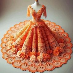 a dress made out of crochet and flowers