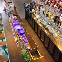 an overhead view of a bar with lots of bottles and glasses on the top shelf