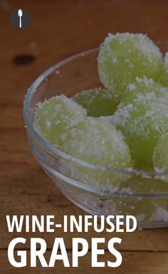 grapes in a glass bowl with the words wine - infused grapes written below it on a wooden table