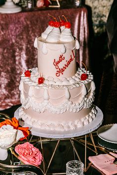 a three tiered cake sitting on top of a table