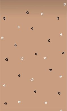 a brown background with black and white hearts