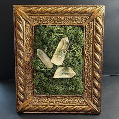 You will receive the exact (1) frame pictured above. It is hand made of clear quartz points and preserved moss in a upcycled frame. The frame is plastic and is able to stand up or be hung on the wall. The frame measures 10 inches tall by 8 inches wide.  The moss used is real preserved moss. It may lose color if it sits in the sun. Do not get the moss wet. The crystals are real clear quartz naturally terminated points.  Please note, pictures were taken with no flash but under an LED light. Refund Moss And Crystals, Crystal Wall Art, Moss Frame, Moss Art, Note Pictures, Preserved Moss, Clear Quartz Point, Craft Booth, Hanging Frames