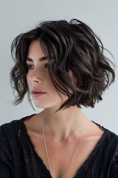 An ultra-modern wavy bob with stark, angular lines and defined waves features a bold, contemporary look. This style is perfect for those who prefer a sharp, geometric haircut that makes a dramatic impact. A Line Bob Wavy Hair, Italian Bob Haircut Wavy, Geometric Haircut, Black Bob Hair, Wavy Hair Bob, Short Wavy Bob Haircuts, Wavy Short Bob, Boho Bob, Bob Ideas