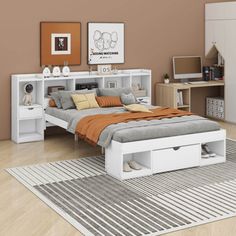 a white bed sitting on top of a wooden floor