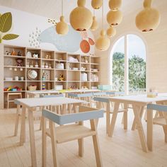 an empty classroom with tables and chairs in front of a large window that looks out onto the outdoors