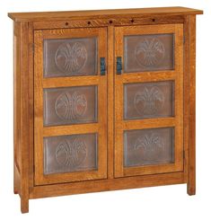 a wooden cabinet with glass doors on the front and side panels inlayed to it