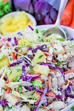 a white bowl filled with coleslaw and carrots