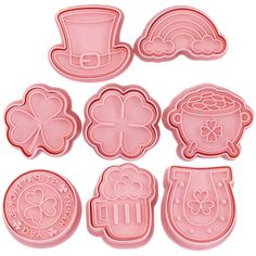 st patrick's day cookie cutters with shamrock hats and clovers on them