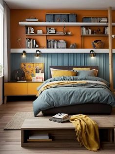 an orange and blue bedroom with bookshelves on the wall, bed in foreground