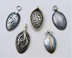 four different types of pendants on a white surface