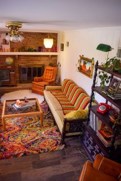 Overhead view of 70s style den with rainbow vintage furniture 70s Family Room, 70’s Home Decor, Retro Living Room 1970s, 70s House Interior, 70s Living Room Aesthetic, 70s House Decor, Dark Cozy Bedroom Ideas, Dark Cozy Bedroom, 70s Living Room