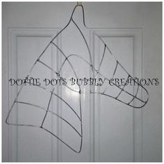 a metal horse head hanging on a door with the words double dots bubble creations above it