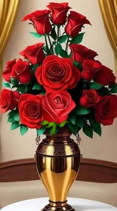 a golden vase filled with red roses on top of a table