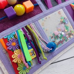 a close up of a bag with beads and other items