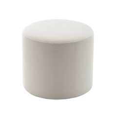 a white round ottoman sitting on top of a table