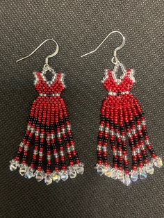 Earring are made with red, black and clear crystal seed beads, plus a Swarovski crystal bicone is placed at the end of each of the 9 dangles. The earrings measure approximately 2.5 inches in length by 1 inch width. Red Dress Earrings, Beaded Red Dress, Traditional Red Beaded Earrings, Red Beaded Fringe Earrings, Red Beaded Earrings With Black Round Beads, Black And Red Beaded Earrings, Red Beaded Earrings Native, Red Colorful Beaded Dangle Earrings, Red Beaded Dress