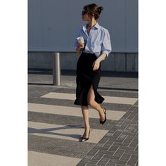 This skirt is designed in a classic pencil silhouette ideal for the office or after-hours events. Made from english non-stretchy wool-blend fabric, it sits on the waist. Has front side slit for more feminine look. Wear it with blazers, turtleneck, silk blouses or cotton shirts. Concealed zip fastening along back.  Has slim silhouette, those who are between sizes should take the next size up. Midi-length, designed to be worn at the waist Concealed zip fastening at back Side slit Length: 73cm without belt Hand wash at 30 degrees Do not bleach or tumble dry Made in Moldova Midi Office Skirt, Office Outfits Women Long Skirt, Medium Black Skirt Outfit, Work Events Outfits, Poses In Pencil Skirt, Work Pencil Skirt Outfit, Outfits With Black Pencil Skirt, Business Casual Long Skirt, Black Silk Skirt Outfit Work