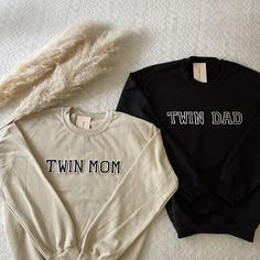 two sweatshirts with the words ivf dad and ivf mom printed on them