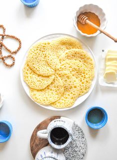 the breakfast is ready to be eaten on the table with other foods and condiments