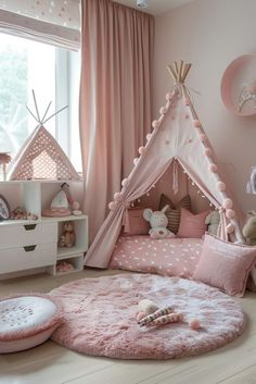 a child's bedroom decorated in pink and white with a teepee tent on the floor