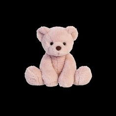 a pink teddy bear sitting down on a black background