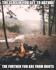 a campfire in the middle of a forest