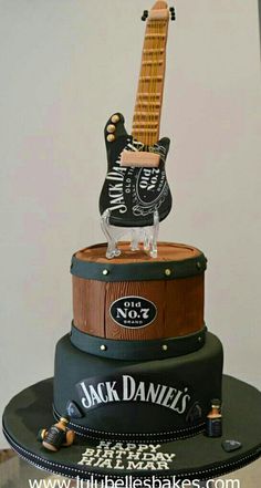 a cake made to look like a guitar with the name jack daniels on it's top