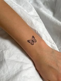 Butterfly tattoo on wrist Small Butterfly Tattoo Back Of Arm, Small Tattoos For Women Butterfly, Small Cute Butterfly Tattoos, Fine Line Tattoo Ideas Butterfly, Right Arm Tattoos For Women, Tattoo The Butterfly, Tatoos Small Butterfly, Two Small Butterflies Tattoo, Small Butterfly Tattoo On Arm