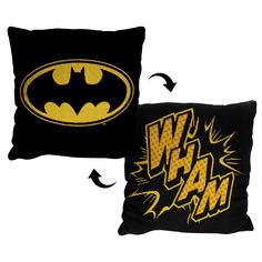 two black and yellow batman pillows with the word wham printed on them, one in gold