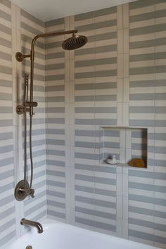 a bathroom with a tub and shower head