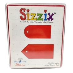 a red plastic sign with the word sizzix on it's back side