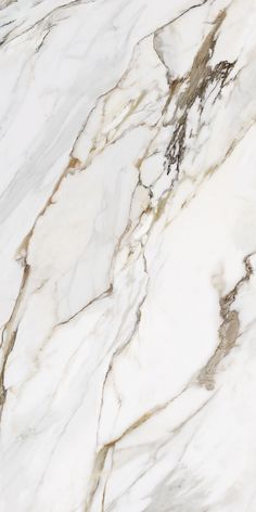 white marble textured with gold veining and brown streaks on the top right side