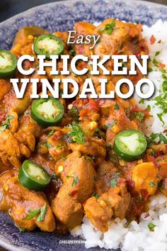 the cover of authentic chicken vindaloo is shown on a plate with rice and cucumbers