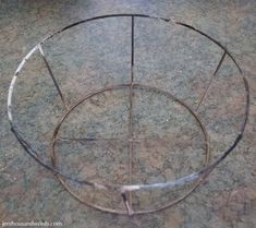 a circular metal object sitting on top of a cement floor