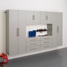 an empty room with cabinets and tools in it