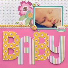 a scrapbook page with the word baby written in large letters and a photo of a baby's face