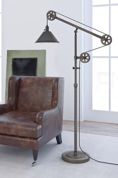 a living room with a chair and lamp in it