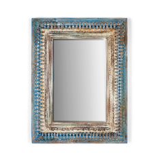 a blue and white mirror hanging on the wall