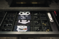 the drawer is full of sunglasses, eyeglasses, and other items that are on display