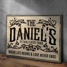 a wooden sign that says the daniels established 1908 where life begins and love never ends