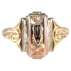 UNISEX RING STYLE / REFERENCE: Art Deco Signet Ring METAL / MATERIAL: 10Kt. Solid Gold Multi Colored Rose, Yellow, White CIRCA / YEAR: 1953 SIZE: 10.25 This classic Art Deco ring is hand constructed for a high school, likely back east in solid 10Kt Gold. The size is 10 1/4. The ring has a stylized date on the sides and is done with a black enamel inlay on the top with the letter W, which was clearly the high school, but I do not know more than that. Nearly 25 years ago I purchased a collection o High School Rings, Class Rings High School, School Rings, Reference Art, Style Reference, Deco Ring, Rose Yellow, Unisex Ring, Ring Metal