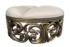 an ornate gold bench with a white cushion