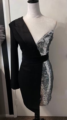 Beautiful one sleeve, silver sequin tuxedo blazer dress. Make a bold statement in this chic dress! * Sizing - All items are made according to measurement ranges, they are NOT typical letter or numeric sizing. It is imperative to compare your exact measurements with the size chart provided either in the listing photos or item descriptions and to also add your measurements under Personalization. If you have any questions on sizing, please feel free to message me. Do not order your normal size with Women Tuxedo, Silver Corset, Pant Dress, Tuxedo Women, Tuxedo Blazer, Singer Dr, Tuxedo Dress, Fantasy Gowns, Black Suit