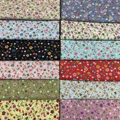 various colors of fabric with small flowers on them