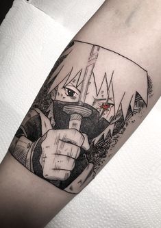 a person with a knife and some sort of tattoo on their arm that is holding something