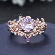 a ring with an amethorate surrounded by diamonds